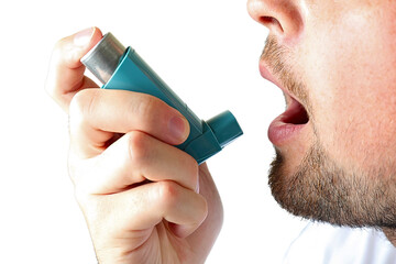 Man using inhaler for asthma relief indoors, isolated on white, PNG