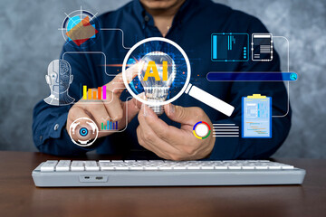 Businessman holding AI light bulb with futuristic interface, artificial intelligence and big data...