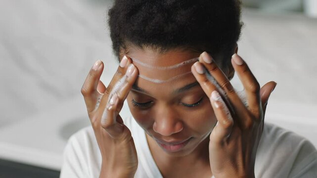 Authentic Black Transgender Woman Embraces Her Skincare Routine with Natural Beauty and Self-Care