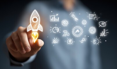 Hand pointing at a rocket illustration with other business ideas.