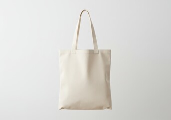 A blank beige canvas tote bag is isolated on white background