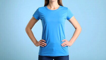 A woman is wearing a plain blue t-shirt isolated on blue background. Perfect for mockup