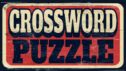 Aged and worn crossword puzzle sign on wood