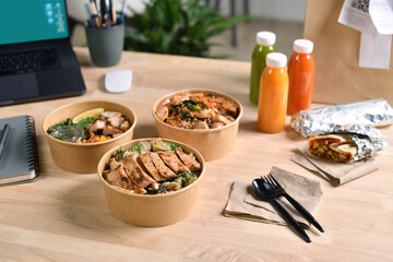 Having a lunch break at the office with delicious Healthy food delivery in take away boxes, Healthy eating concept.