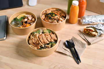 Having a lunch break at the office with delicious Healthy food delivery in take away boxes, Healthy eating concept.