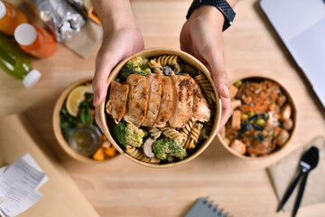Having a lunch break at the office with delicious Healthy food delivery in take away boxes, Healthy eating concept.