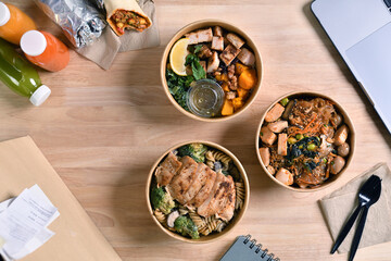 Having a lunch break at the office with delicious Healthy food delivery in take away boxes, Healthy eating concept.