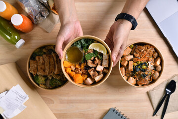 Having a lunch break at the office with delicious Healthy food delivery in take away boxes, Healthy eating concept.