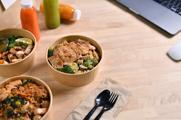 Having a lunch break at the office with delicious Healthy food delivery in take away boxes, Healthy eating concept.
