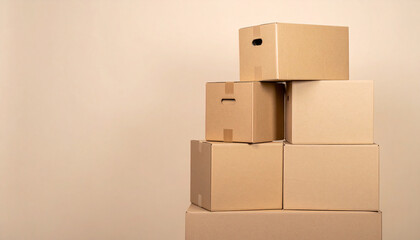 Stack of brown cardboard boxes on a neutral background, ideal for moving, shipping, or storage concepts with space for text.