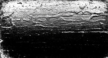 A black and white photo of a rocky shoreline with a dark sky