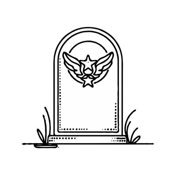 Vintage tombstone with military emblem surrounded by grass 