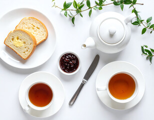 Elegant tea setup with slices of bread and jam, perfect for a cozy afternoon.
