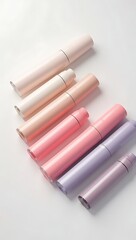 Fototapeta premium Minimalist skincare product mockup with unbranded lotion bottles and cream jars in pastel colors arranged on clean white background.