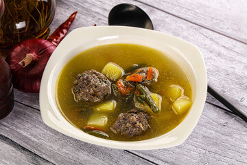 Soup with beef meatballs and vegetables