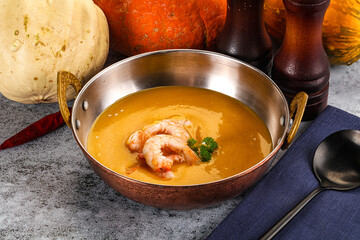 Pumpkin cream soup with prawns