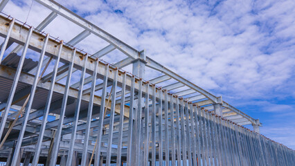 Fototapeta premium Steel frame of a new commercial building under construction