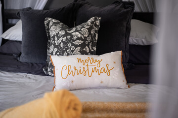 decorative cushion with Merry Christmas in a cursive font