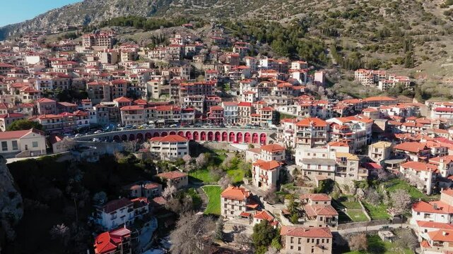 Arachova mountain town, uphill houses, cobbled streets, Greek National Highway 48, Boeotia, Drone shot, Establishing