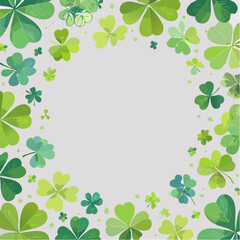 Minimal vector of green shamrocks forming a soft border around a white background with space for text.