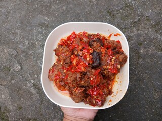 Jerado balado or Dendeng balado is a traditional cuisine from west sumatera, indonesia. it is made from slice of beef with spicy sauce called sambal