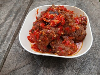 Jerado balado or Dendeng balado is a traditional cuisine from west sumatera, indonesia. it is made from slice of beef with spicy sauce called sambal