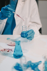 Fototapeta premium Research, experiment and medical trial being done by a scientist in a lab, science facility or hospital. One young, serious and professional researcher organizing, sorting or making a discovery