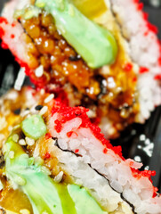Close-up photo of Sushi roll envelope ebi sandwich. Tasty asian food.