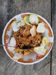 tahu telur or tahu gimbal or tahu tek or egg tofu. is a typical food of the city of Semarang. This food consists of fried tofu, chopped raw cabbage, rice cake, bean sprouts, eggs