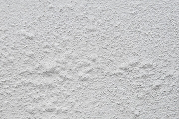 Old concrete wall with blistered paint and air bubbles