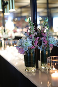 candles and flowers leaning on mirror