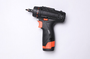 Modern cordless screwdriver on white background. Top view