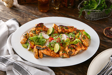 Grilled fish assortment, bright rustic lighting, overhead composition with lime and fresh greens