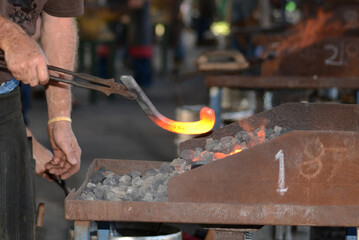 red hot horseshoe drawn from the forge