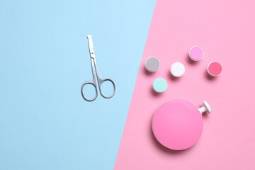Modern device electric nail file with attachments and scissors. Top view