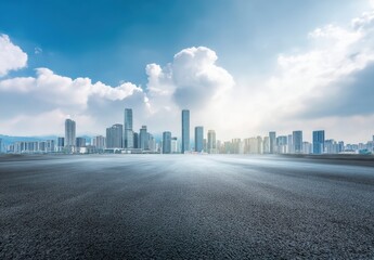 Panoramic view of empty asphalt road and cityscape against blue sky with white clouds, sunlight reflection on the ground