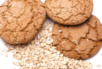 Cereal cookies and oat flakes on a white background