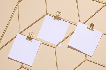 White square memo cards mockups attached to gold grid mood board on beige background
