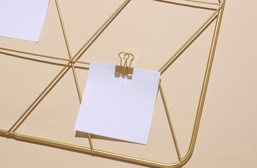 White square memo cards mockups attached to gold grid mood board on beige background