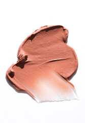 Shape and texture, Strokes of beige foundation on white background