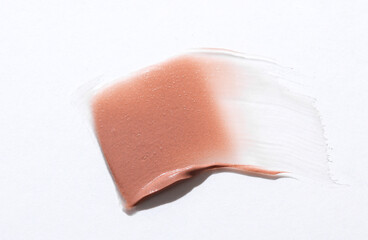 Shape and texture, Strokes of beige foundation on white background