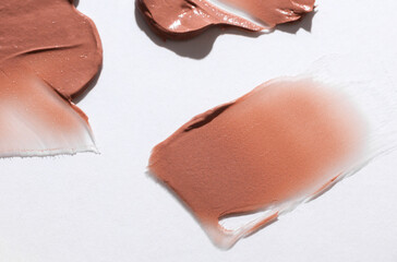 Shape and texture, Strokes of beige foundation on white background