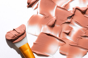 Shape and texture, Strokes of beige foundation on white background