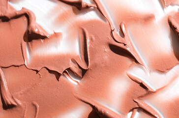 Shape and texture, Strokes of beige foundation on white background