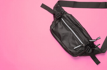 Black banana bag on a pink background