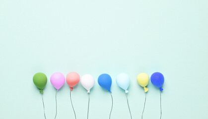 Miniature balloons on a blue background