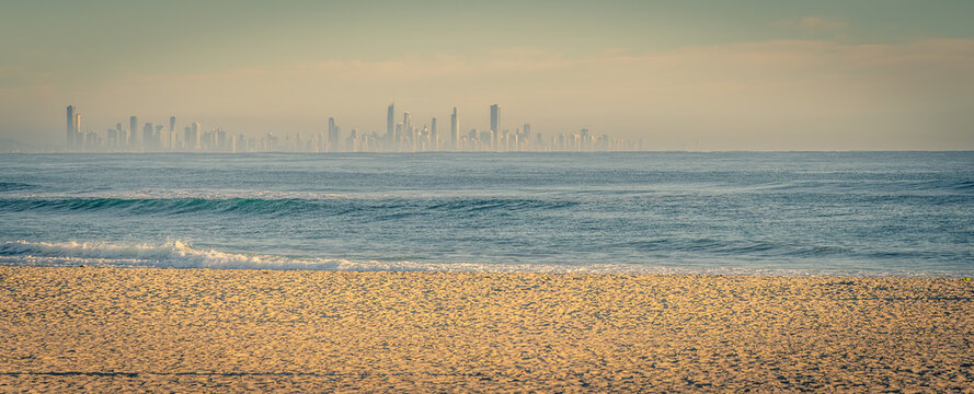 Looking across from Coolangatta to the Gold Coast skyscrapers on a misty morning. Queensland, Australia.