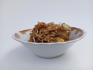 tahu telur or tahu gimbal or tahu tek or egg tofu. is a typical food of the city of Semarang. This food consists of fried tofu, chopped raw cabbage, rice cake, bean sprouts, eggs