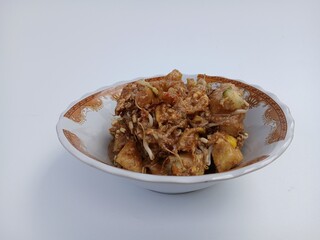tahu telur or tahu gimbal or tahu tek or egg tofu. is a typical food of the city of Semarang. This food consists of fried tofu, chopped raw cabbage, rice cake, bean sprouts, eggs