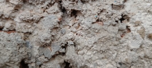 Close-Up of Rough Sand and Cement Plaster on New Wall, Raw Construction Texture with Gritty Surface, Background for Building, Renovation, or Industrial Design Concepts